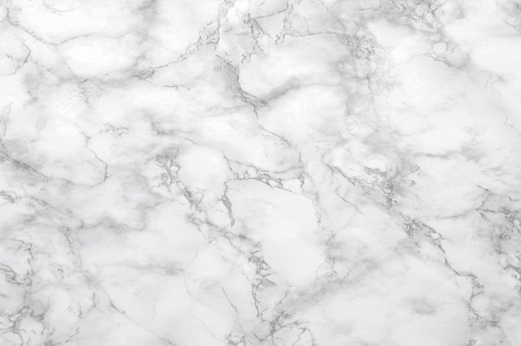Marble background.White stone texture with gray shadow.Panoramic format.